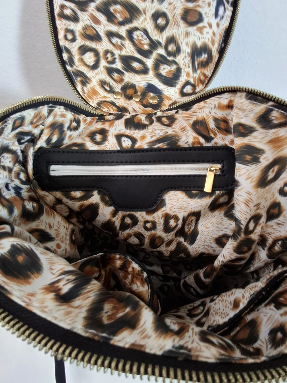 SWG Black Pebbled Sling Barrel Backpack with Gold Accents